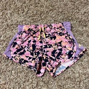 NIKE FLOWERED SHORTS.